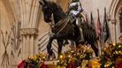 Windsor Castle | Festive garlands on the Grand Staircase hang below statues of Knights on horseback. Royal Collection Trust / © His Majesty King Charl