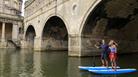 Stand up paddle boarding under Pulteney Bridge