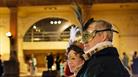 A man and a woman at a masked ball