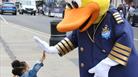 Girl gives the Windsor Duck a 'high five'