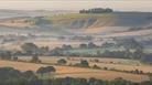 The rolling hills of the Vale of Pewsey in the mist