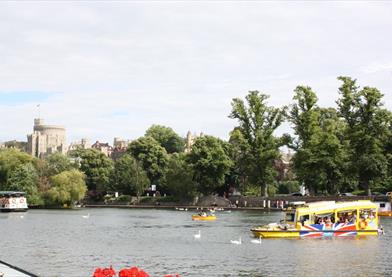 Windsor Duck Tours on River Thames with Windsor Castle in distance