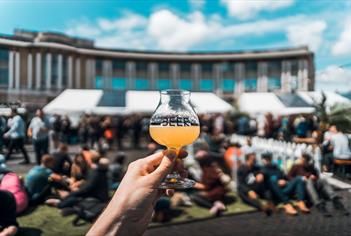 Hand holding beer at Bristol Craft Beer Festival
