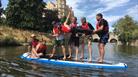 7 people on paddle board for original wild
