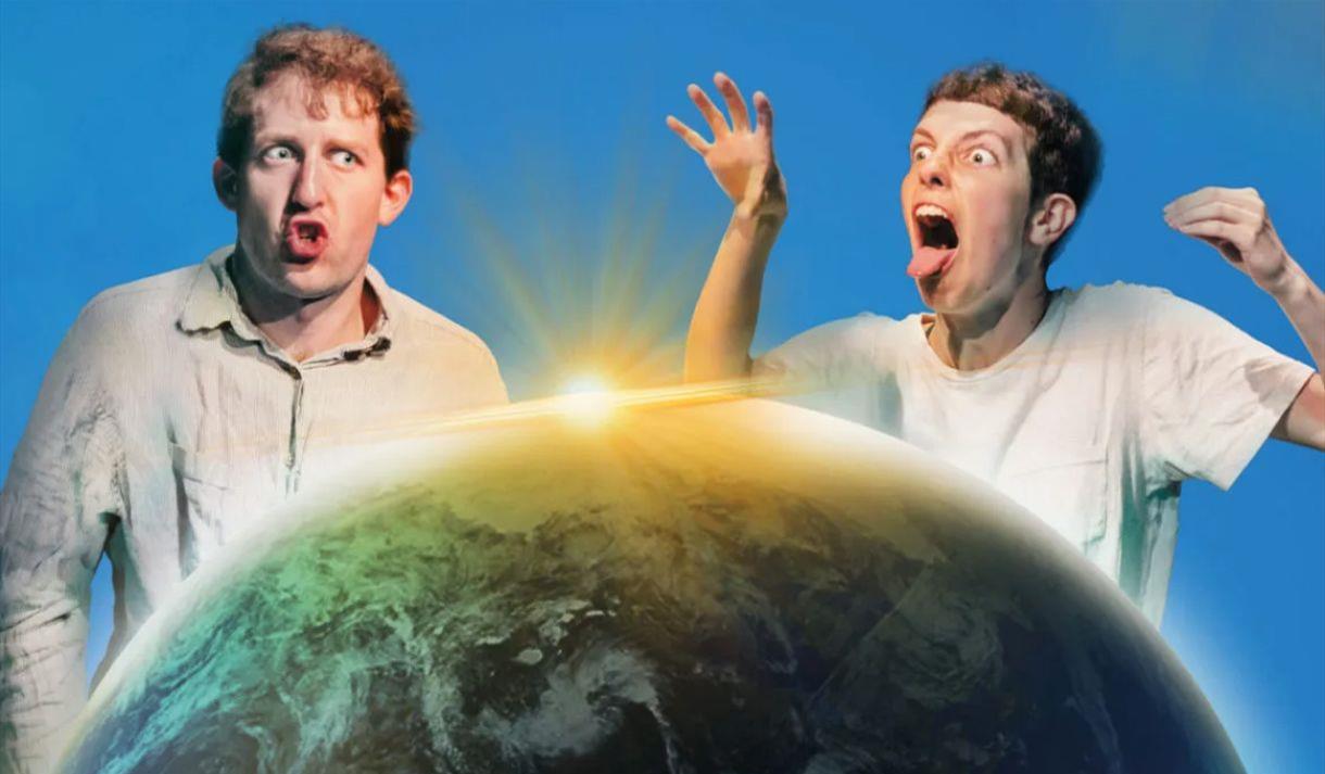 Two men pulling faces next to an image of the planet Two men pulling faces next to an image of the planet