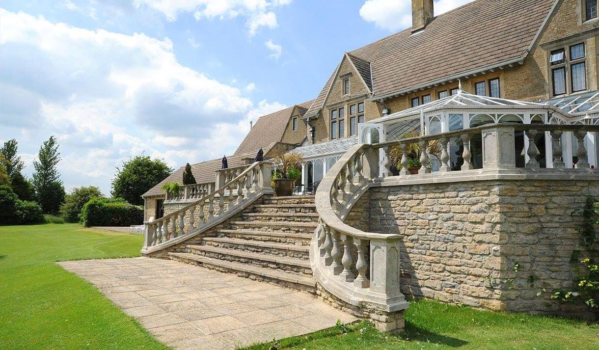 Cricklade House Hotel garden and stone steps to outside patio