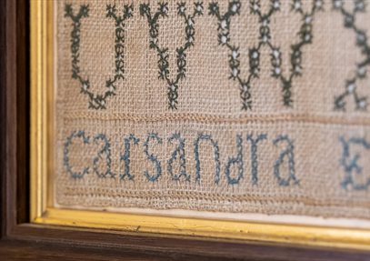 Sewing circle at Jane Austen's House. Sampler by Cassandra Austen at Jane Austen's House.