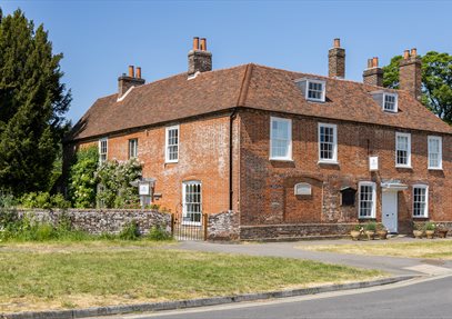 Jane Austen's House - a red bricked house with multiple chimneys