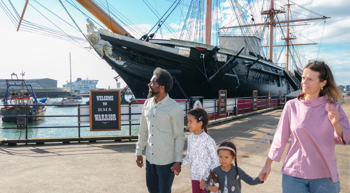 Family by HMS Warrior at Portsmouth Historic Dockyard