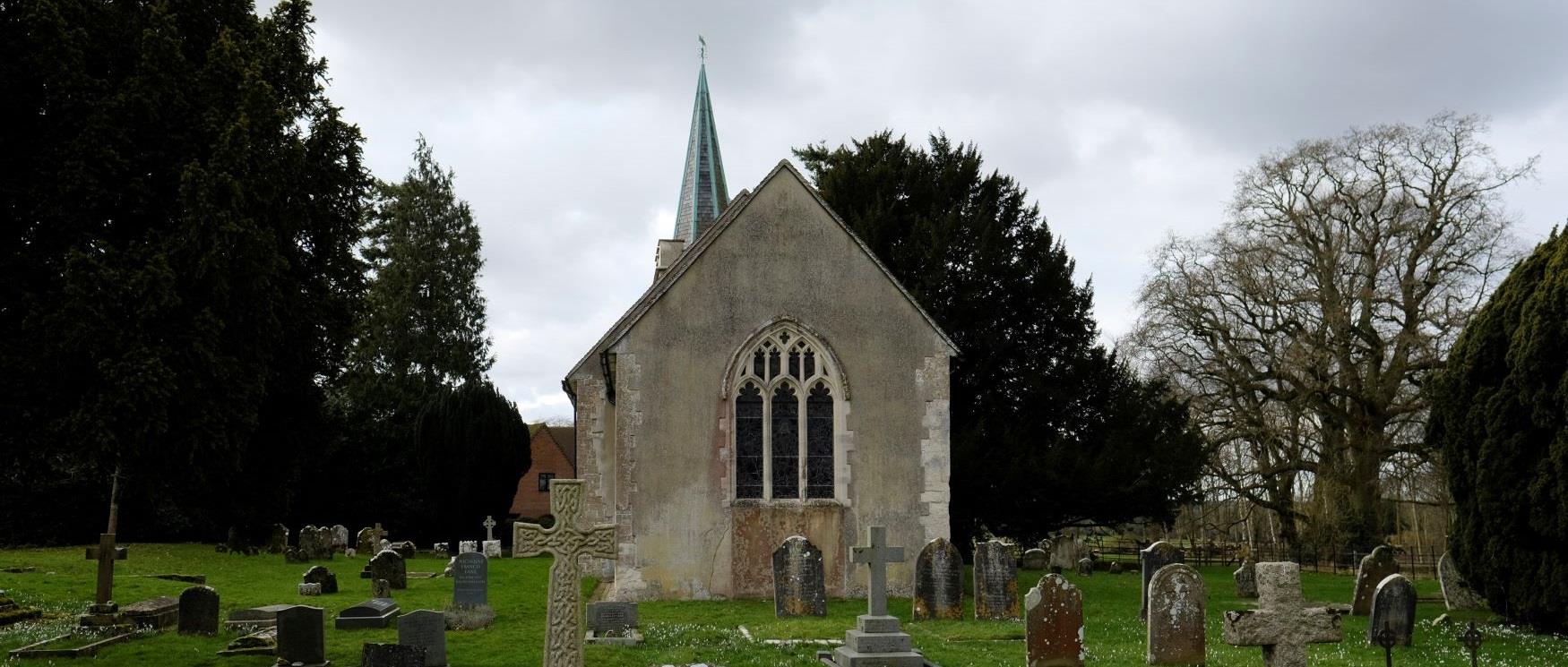 Steventon Church in Hampshire, a small historic church surrounded by gravestones, in the area where author Jane Austen grew up.