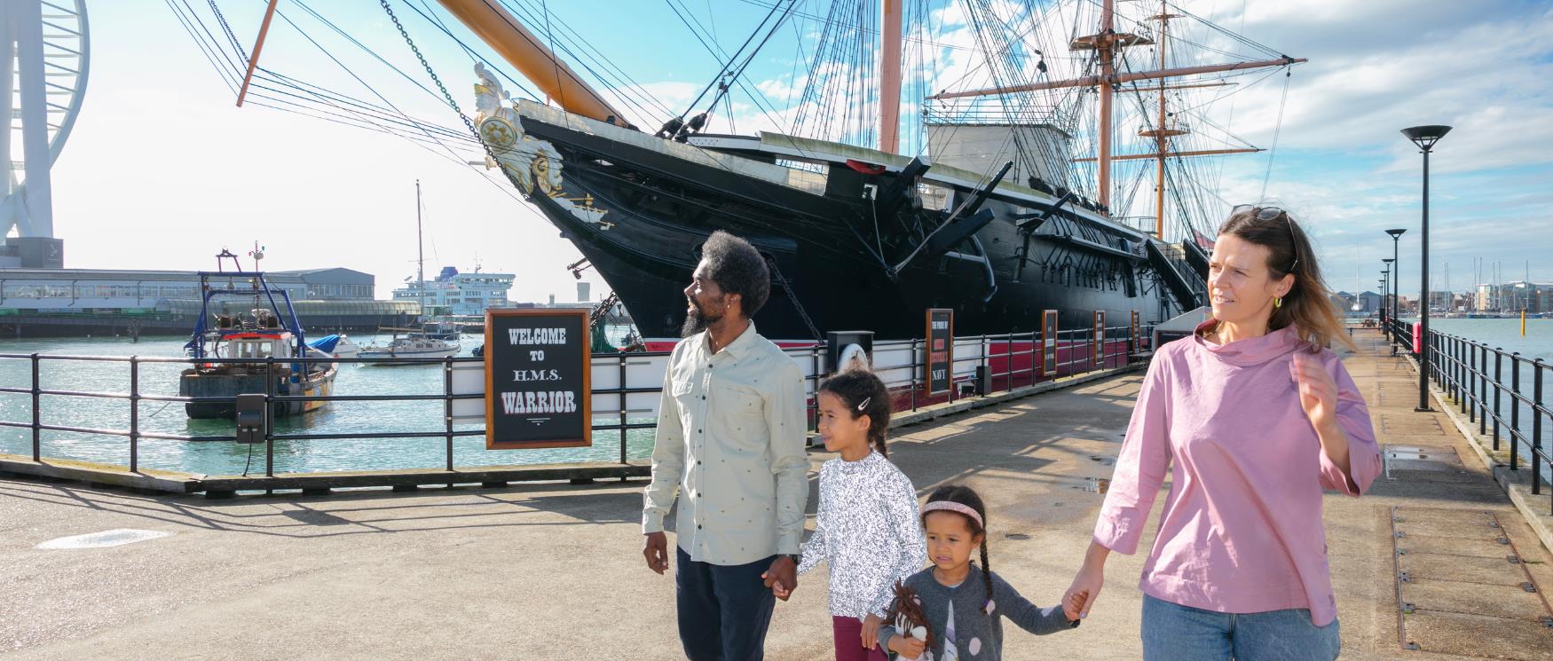 Family by HMS Warrior at Portsmouth Historic Dockyard