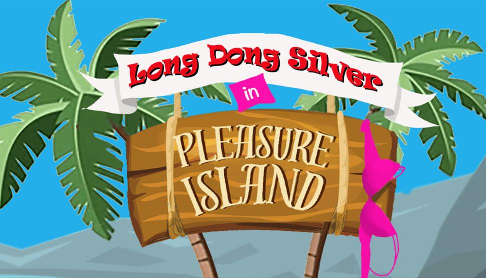 A wooden sign, on a a tropical beach, for the show 'Long Dong Silver in Pleasure Island' which has a pink bra hanging off of it.
