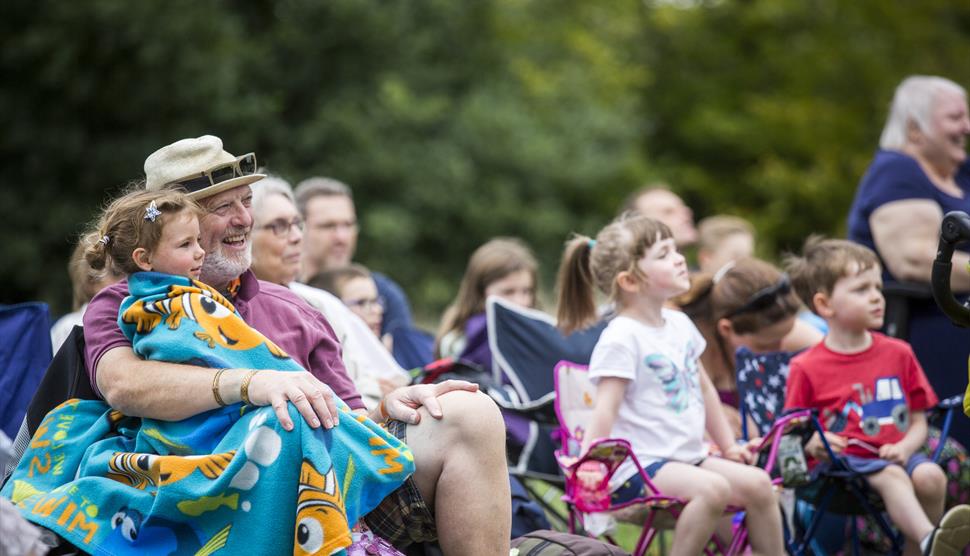 Families enjoy an outdoor event.