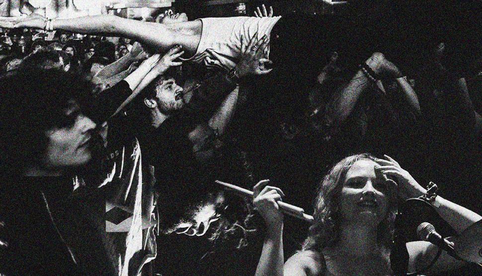 B&W image of a busy Alien Chicks gig