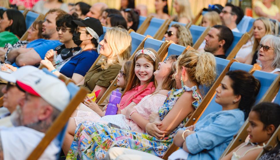 A crowd enjoys an outdoor event.