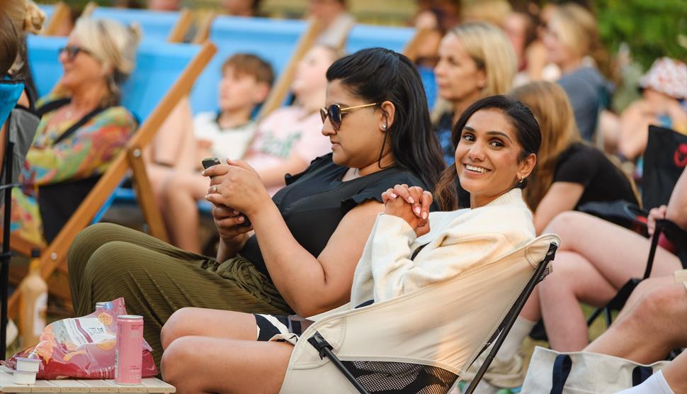 A crowd enjoys an outdoor event.