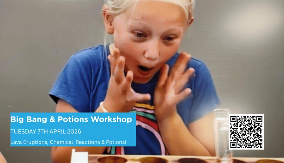 Young Blond girl looking happily excited at a test tube bubbling from a lava experiment at an event.
