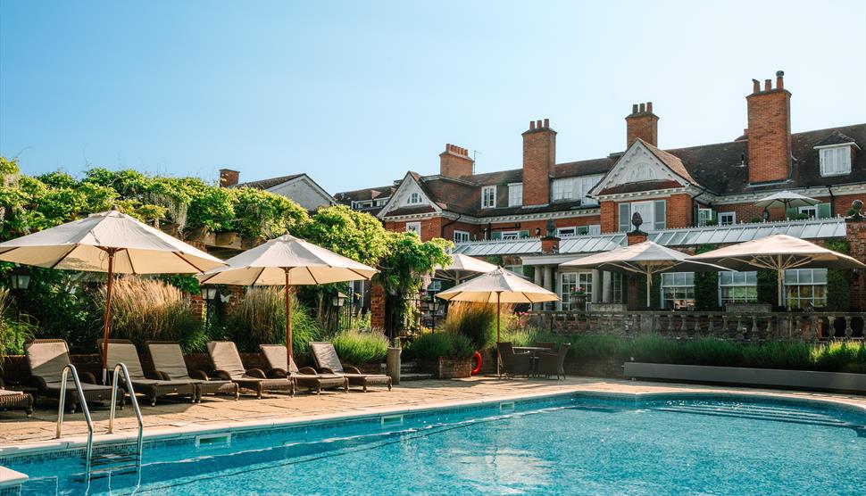 Outside swimming pool and decking area at Chewton Glen Hotel & Spa
