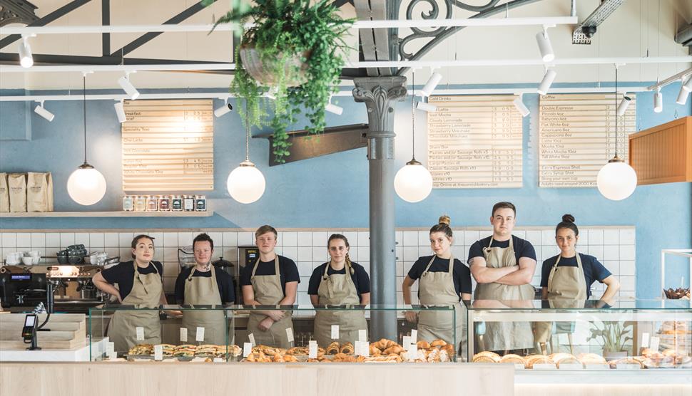 Members of staff stood inside Cornish Bakery, Winchester