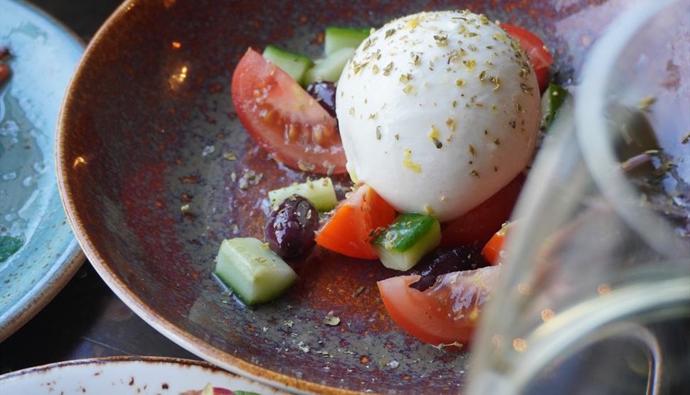 A selection of dinner plates with food on at Sant-Yago