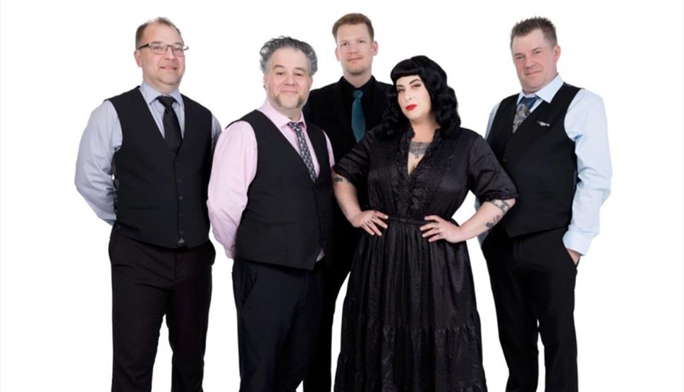 Press shot for Davina and the Vagabonds, featuring the five members of the band against a white background