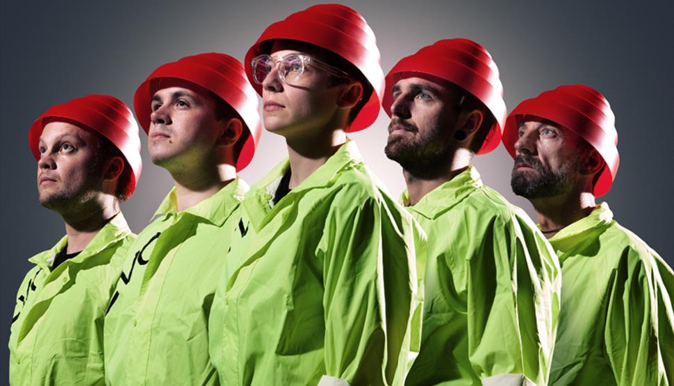 The five members of We Are Not Devo wearing the signature red hats