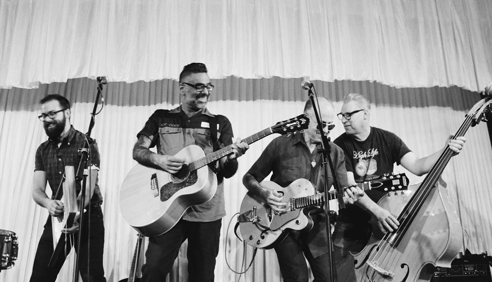 Black and white photo showing The Dodge Brothers playing their instruments