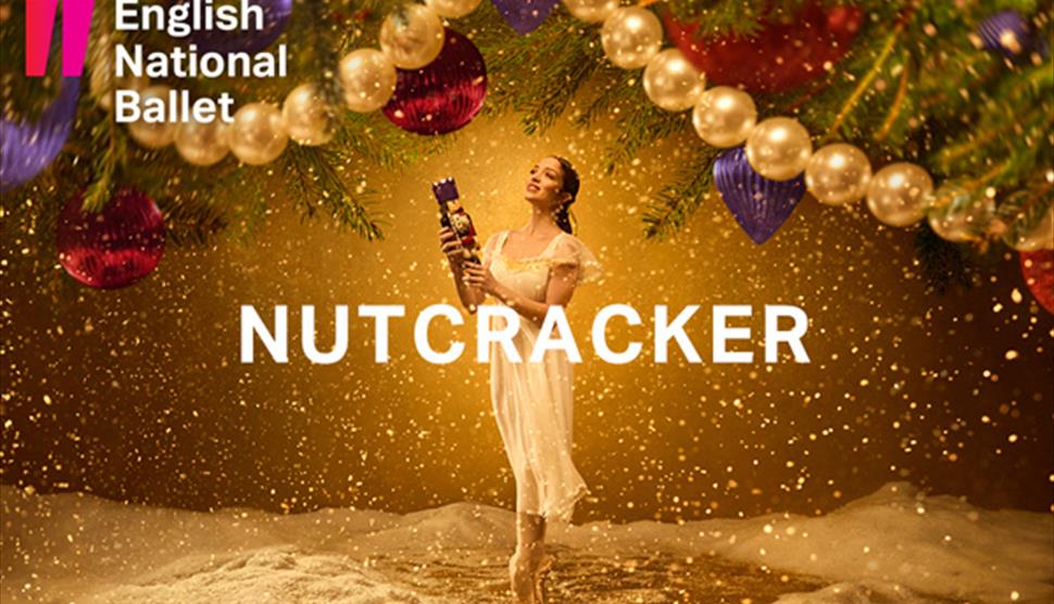 Ballerina holds a nutcracker doll