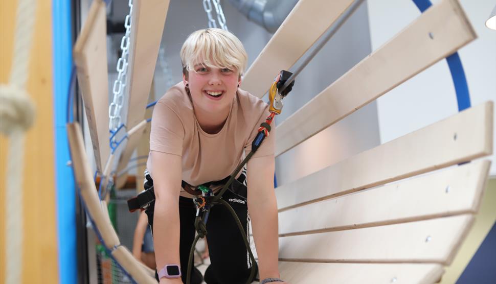 High Ropes smiling girl in tunnel