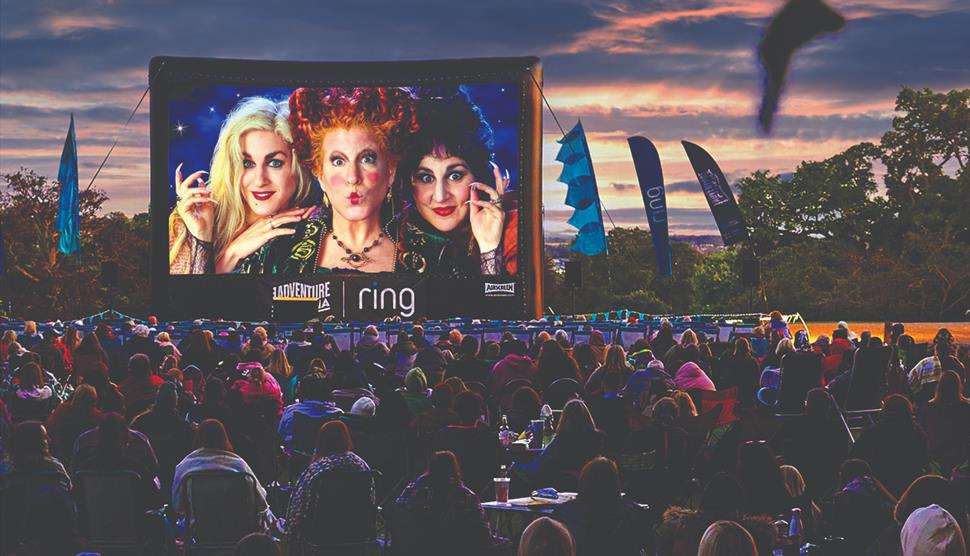 An audience watches outdoor cinema Hocus Pocus Spooktacular (PG).
