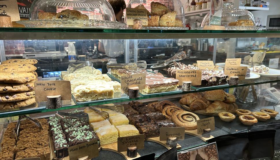 A selection of cakes and pastries on display at The Oaty Goat cafe