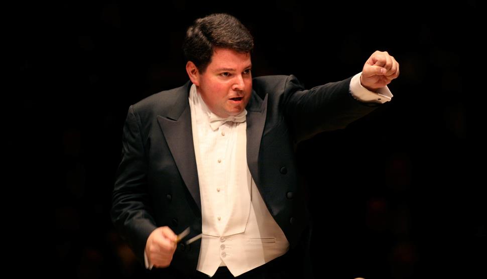 Close up of Conductor Andrew Litton on stage