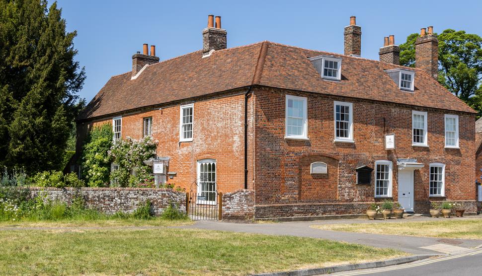 Jane Austen's House - a red bricked house with multiple chimneys