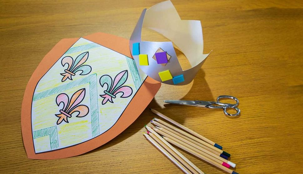 Paper crown and shield made at the Mary Rose Museum