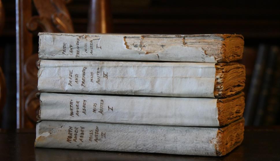 Early-edition volumes of Austen's Pride & Prejudice and Northanger Abbey.