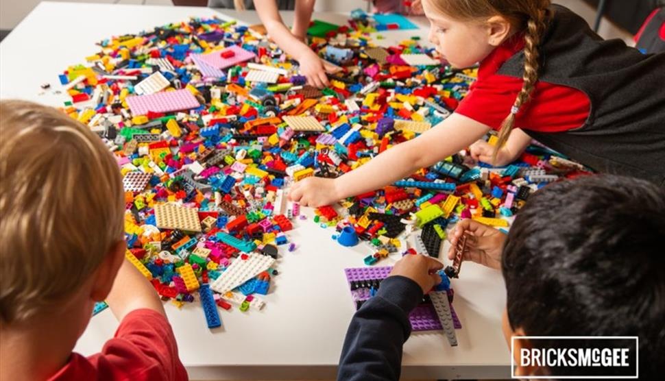 Children playing with LEGO at a Bricks McGee event