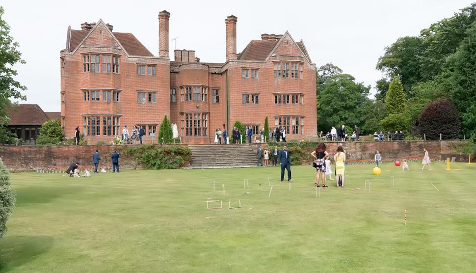 New Place Hotel playing croquet on lawn at wedding