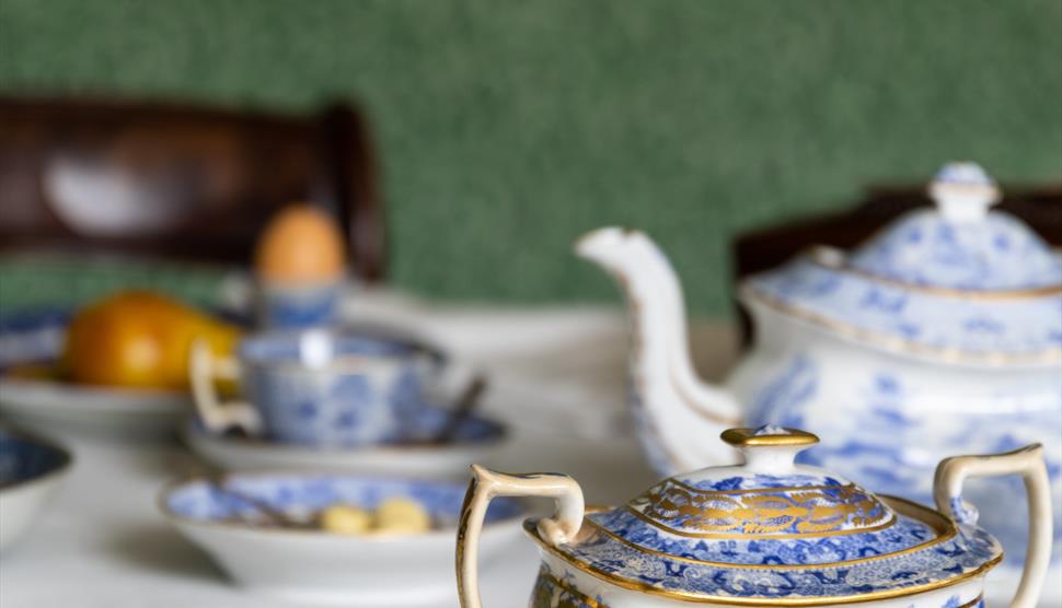 Blue and white china on the dining table at Jane Austen's House