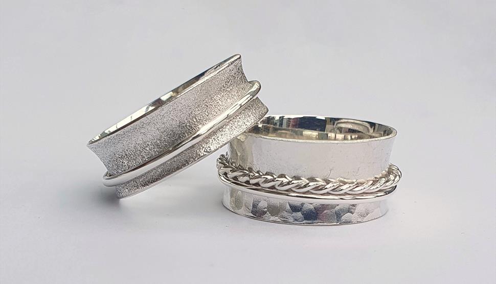 Photograph of two silver spinner rings