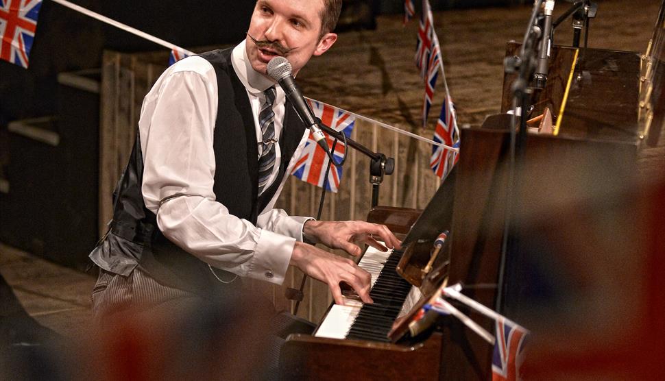 Tom Carradine at the piano. Join in with Carradine's Cockney Sing-a-long at Steam Town on Friday 11th April.