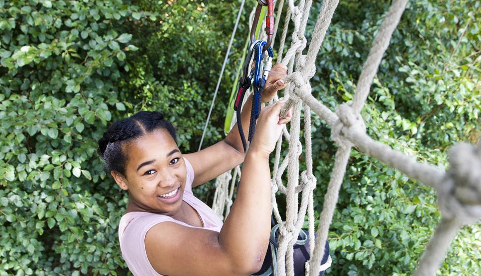 Climbing the cargo net after the Tarzan swing at Go Ape Moors Valley