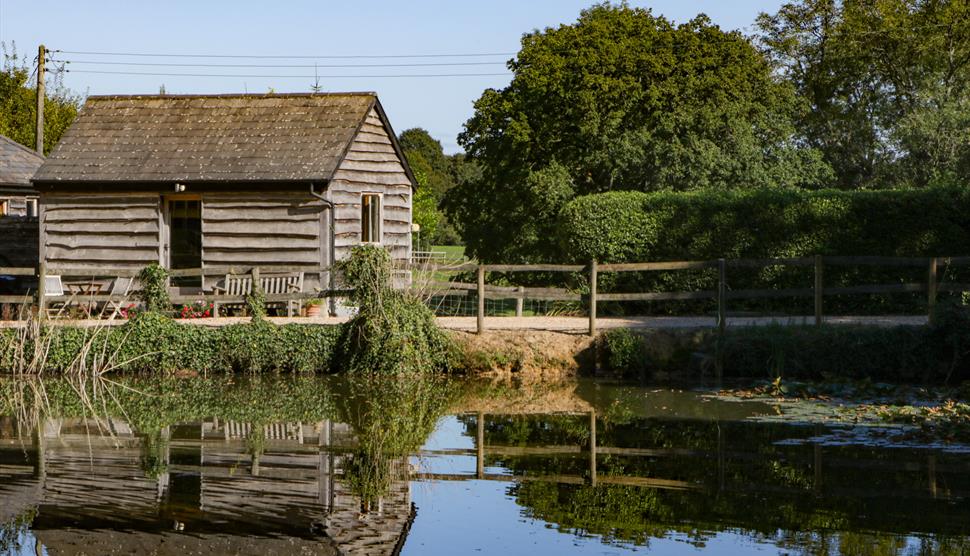 Exterior and reflection of The Little Granary