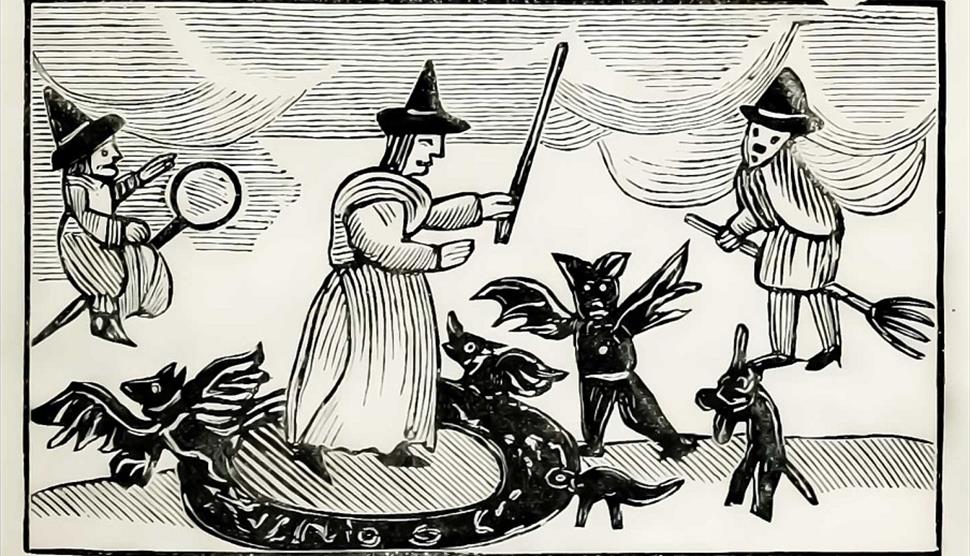 Wood carving of Tudor witches