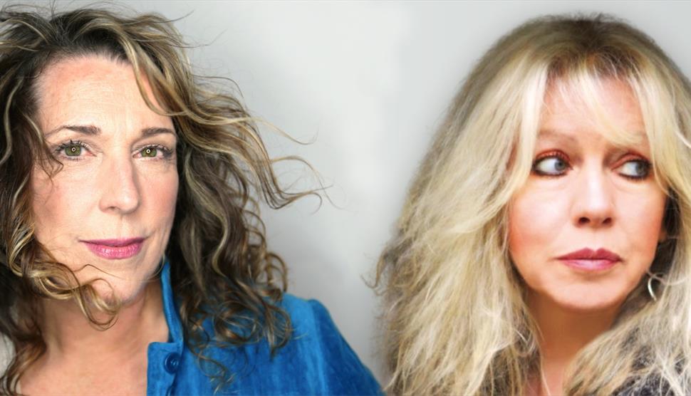 Two women with long hair face the camera.