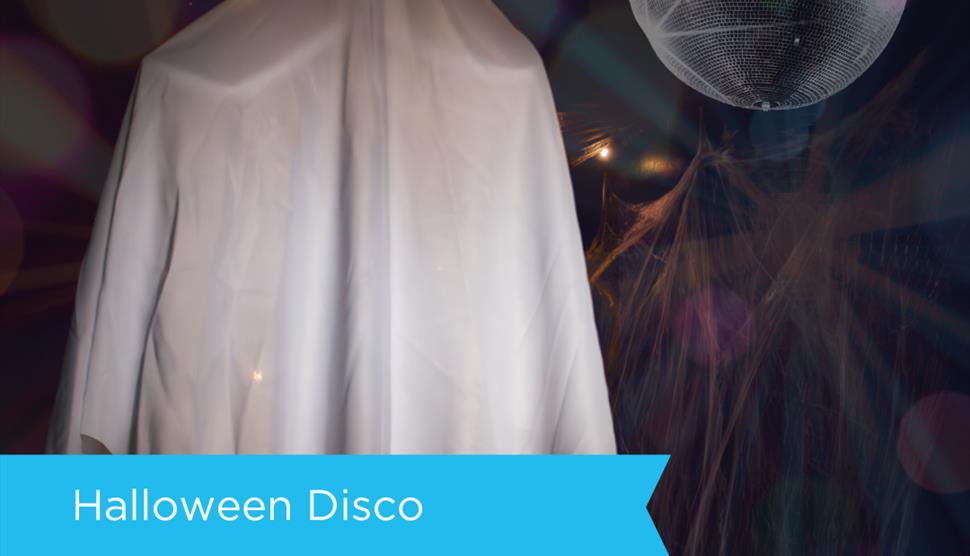 spooky ghost dancing under a disco ball at sky park farms mini halloween disco
