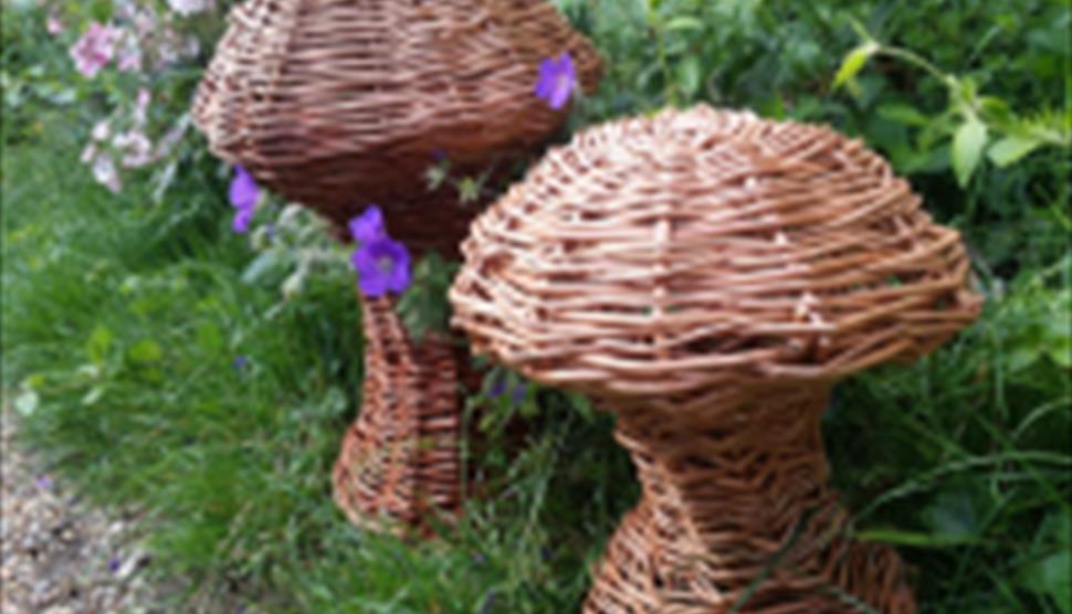 willow mushroom sculptures on grass