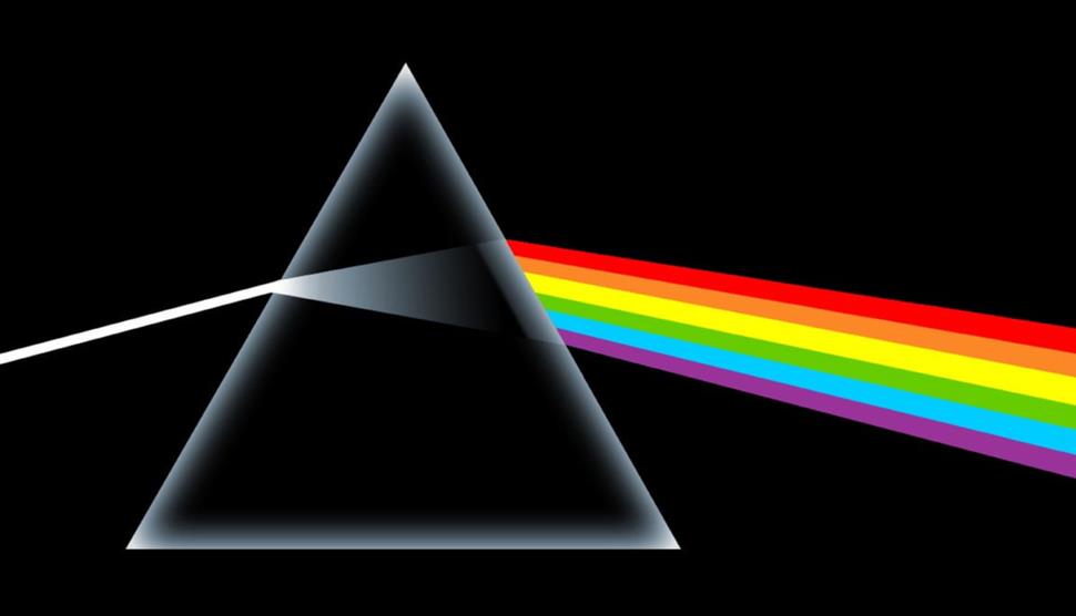 Pink floyd album cover artwork. There is a white triangle and a rainbow coming from the right hand side of the triangle.