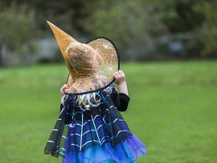 Girl in Witches Hat in gardens