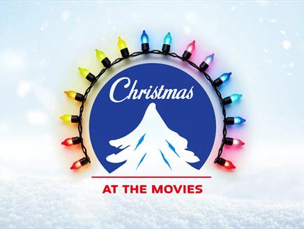 A Christmas logo circle surrounded by colourful lights.