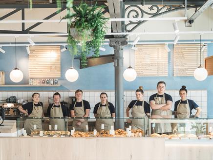 Members of staff stood inside Cornish Bakery, Winchester